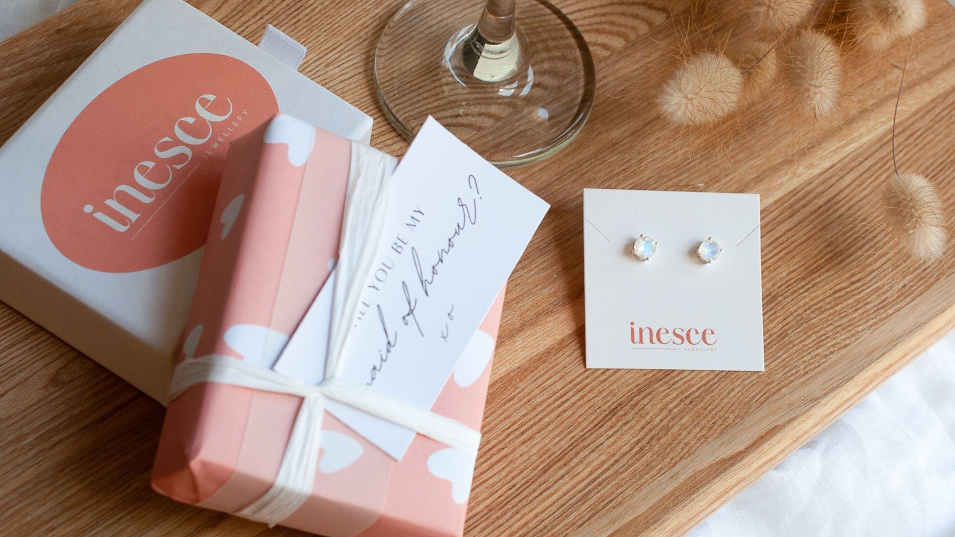 bespoke gift wrapping jewellery box with earrings beside