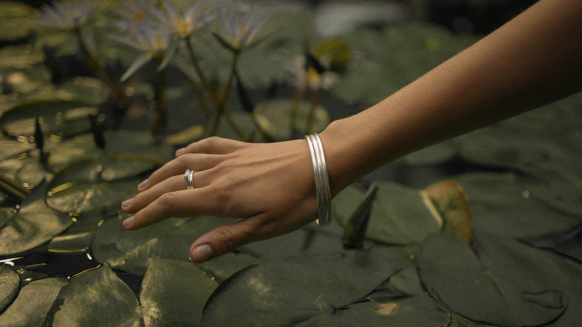 woman wearing silver crystal jewellery from around the world