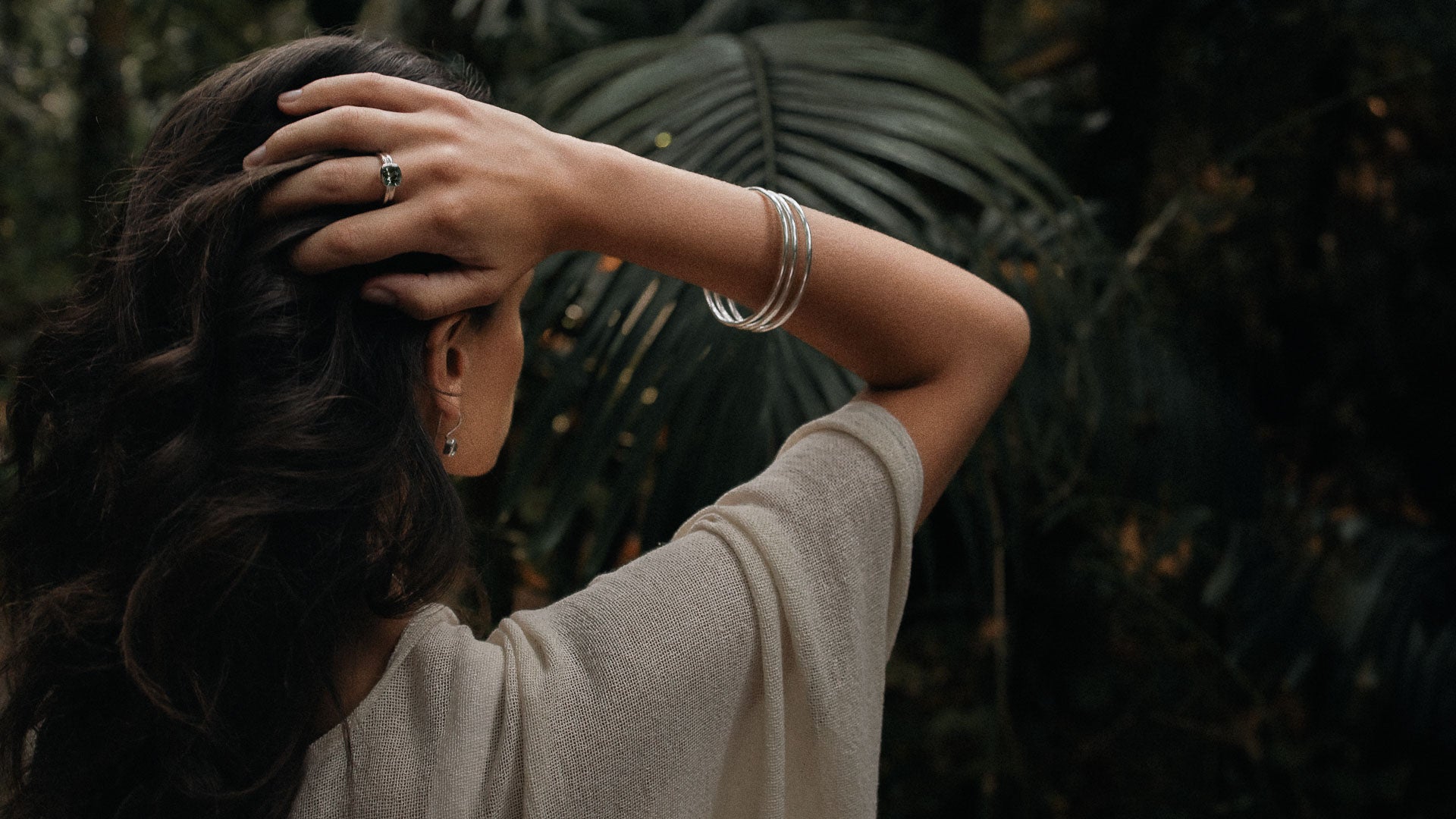 bohemian woman showing a perfect way to adorn oneself in coloured gemstone jewellery