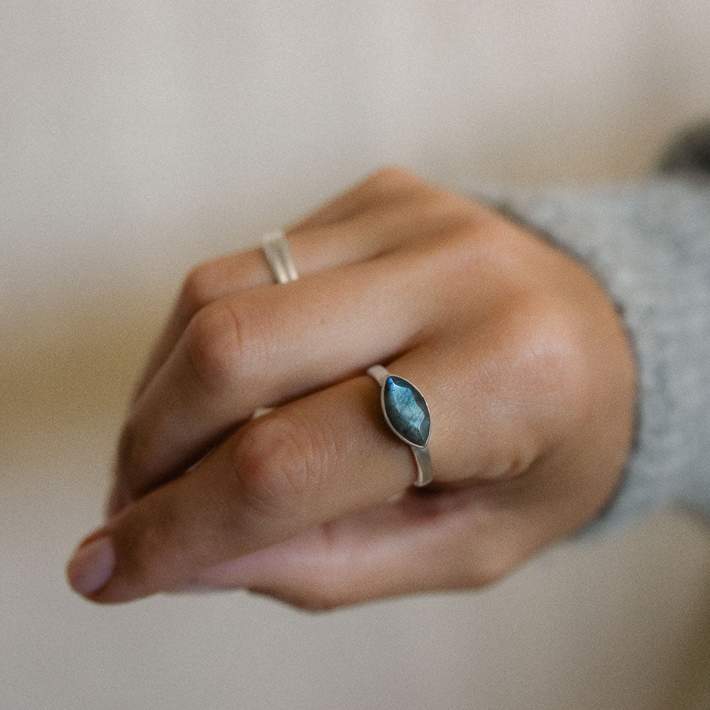 woman wearing marquise labradorite gemstone ring