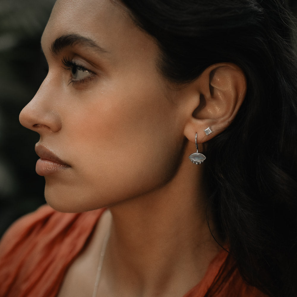 woman wearing marquise moonstone gemstone earrings
