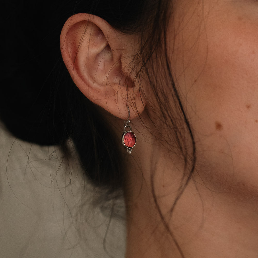 women wearing pink tourmaline earrings