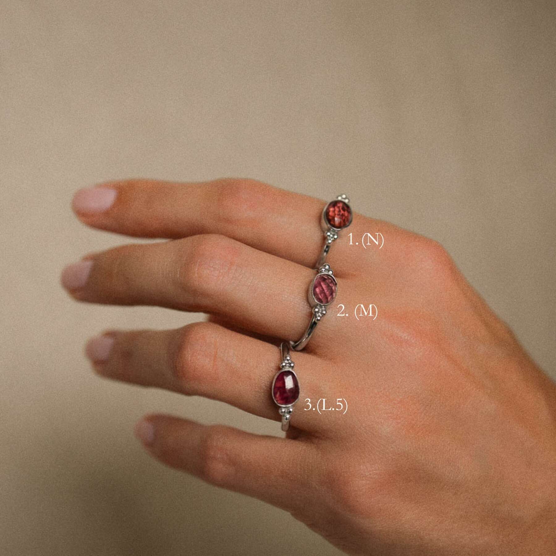 pink tourmaline rings on womans fingers options