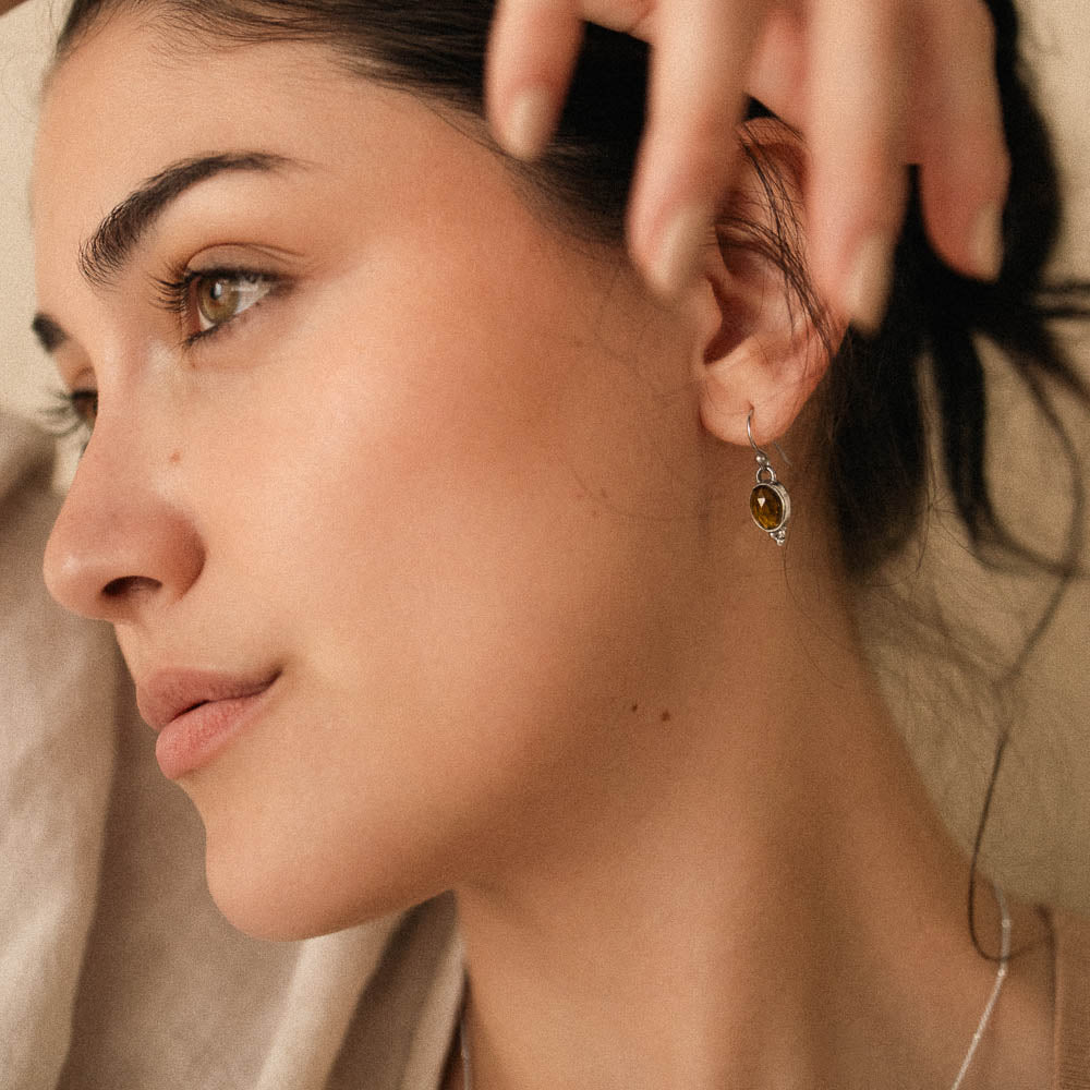 women wearing yellow tourmaline earrings