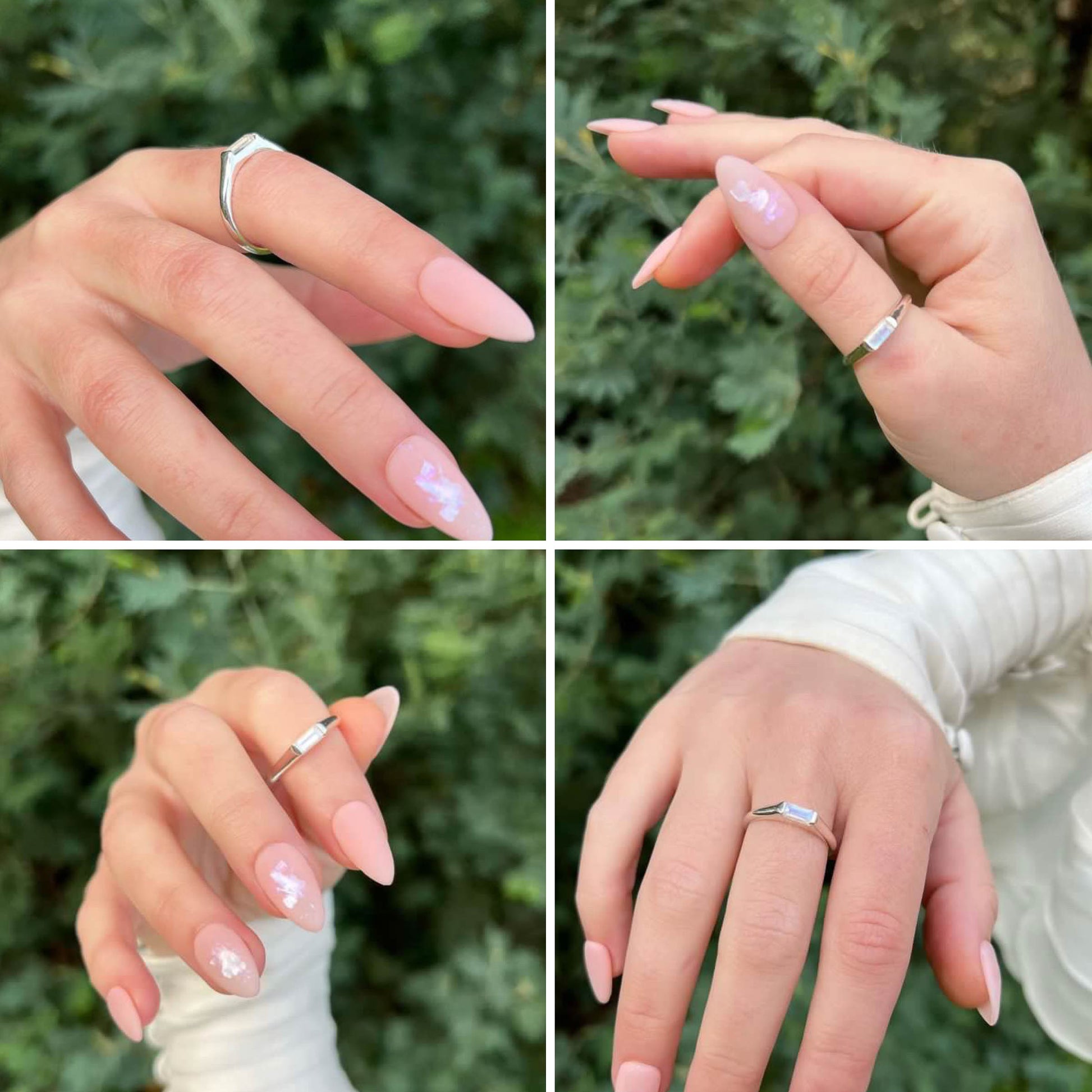 womans hand manicured nails wearing midi baguette moonstone silver ring 