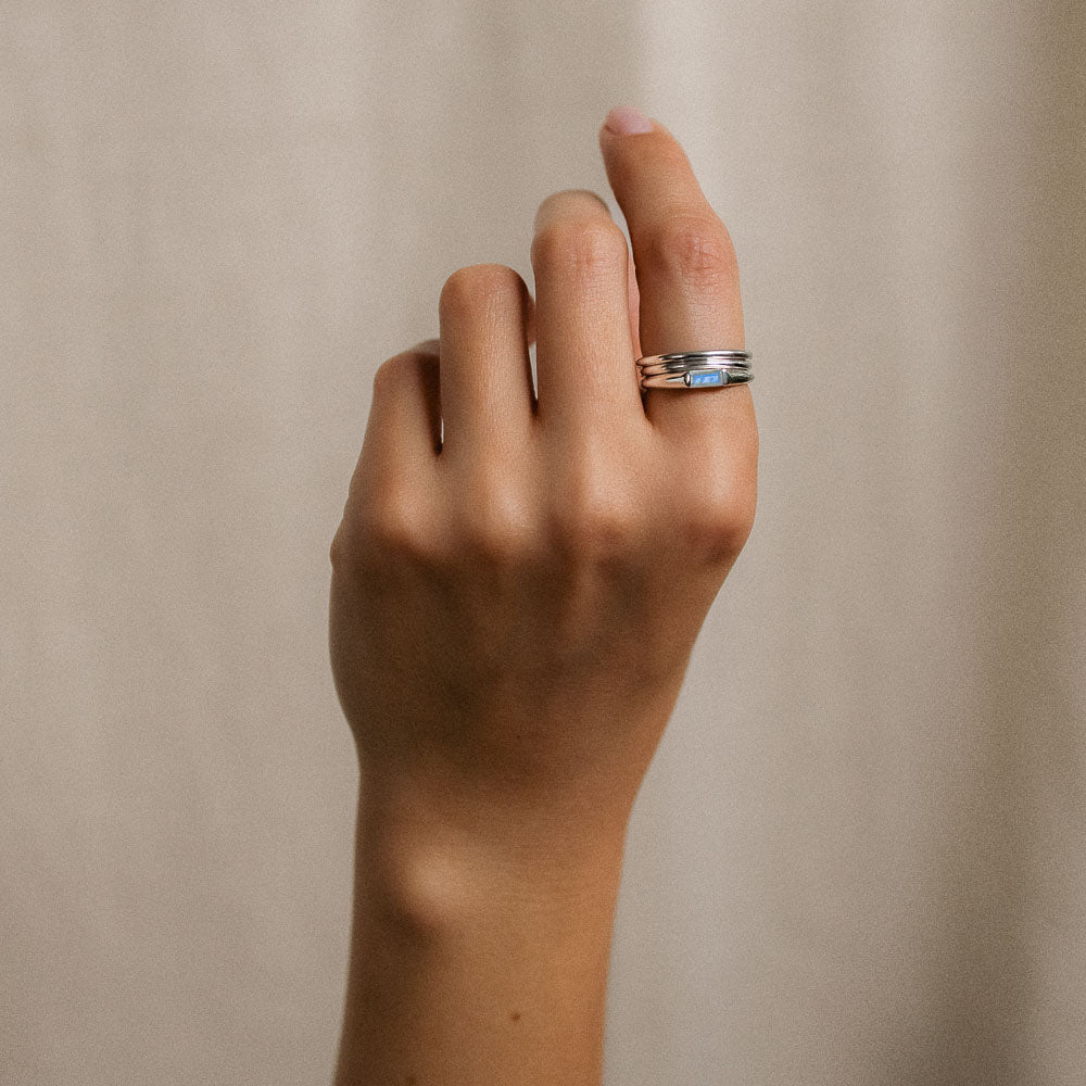 moonstone baguette silver ring on finger